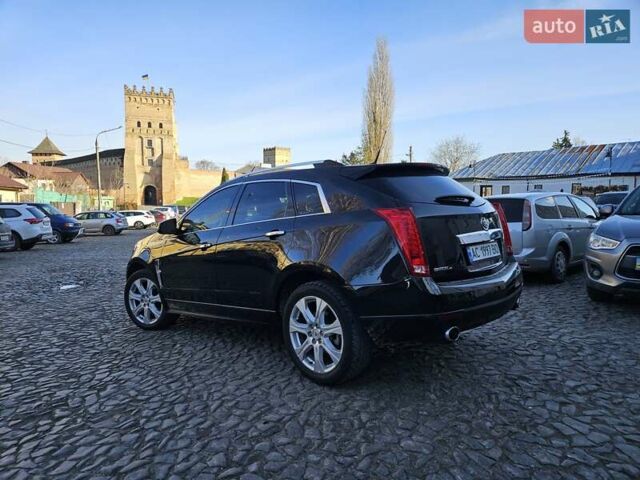 Чорний Каділак SRX, об'ємом двигуна 2.99 л та пробігом 209 тис. км за 11900 $, фото 2 на Automoto.ua