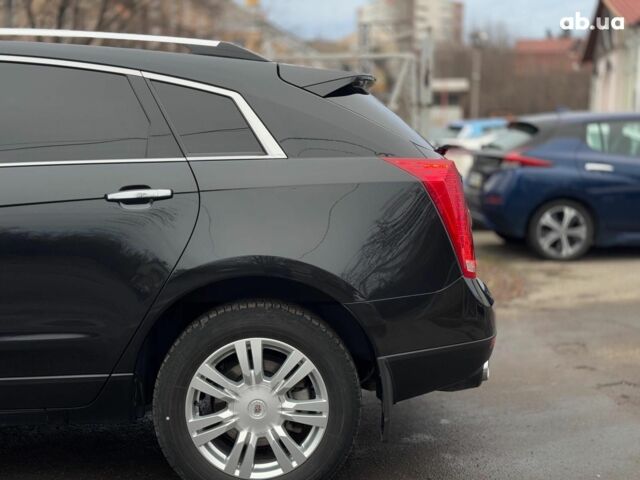 Чорний Каділак SRX, об'ємом двигуна 3 л та пробігом 195 тис. км за 10790 $, фото 10 на Automoto.ua