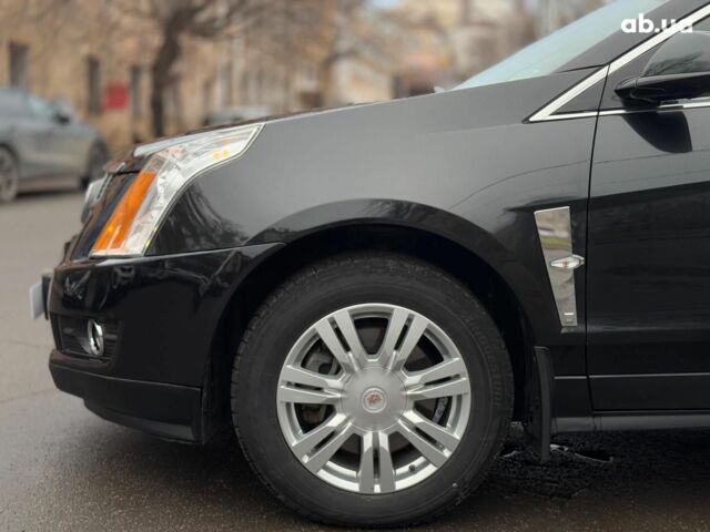 Чорний Каділак SRX, об'ємом двигуна 3 л та пробігом 195 тис. км за 10790 $, фото 8 на Automoto.ua