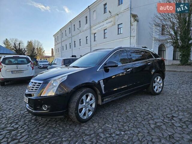 Чорний Каділак SRX, об'ємом двигуна 2.99 л та пробігом 209 тис. км за 11900 $, фото 1 на Automoto.ua