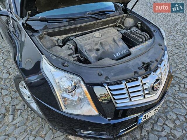 Чорний Каділак SRX, об'ємом двигуна 2.99 л та пробігом 209 тис. км за 11900 $, фото 14 на Automoto.ua