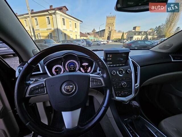 Чорний Каділак SRX, об'ємом двигуна 2.99 л та пробігом 209 тис. км за 11900 $, фото 6 на Automoto.ua
