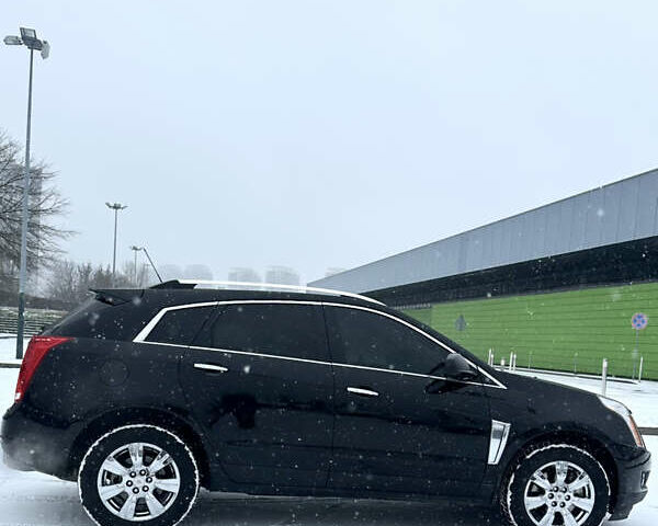 Чорний Каділак SRX, об'ємом двигуна 3.6 л та пробігом 192 тис. км за 12000 $, фото 3 на Automoto.ua