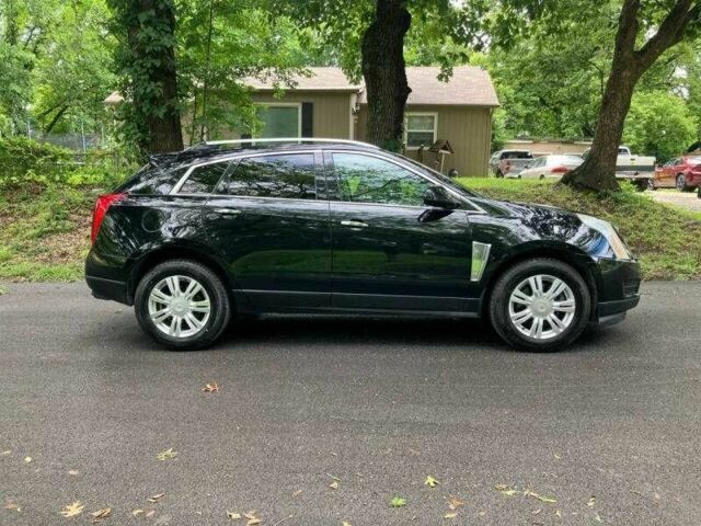 Чорний Каділак SRX, об'ємом двигуна 3.6 л та пробігом 64 тис. км за 3600 $, фото 1 на Automoto.ua