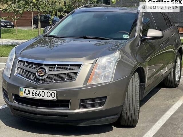 Коричневий Каділак SRX, об'ємом двигуна 3 л та пробігом 204 тис. км за 11000 $, фото 2 на Automoto.ua