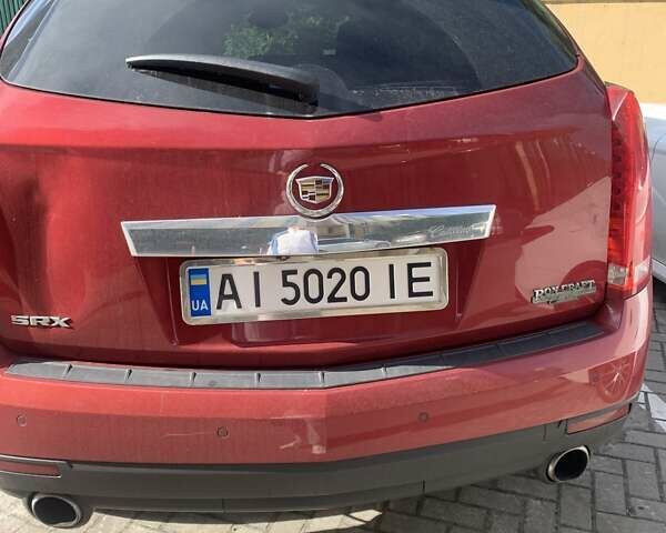 Червоний Каділак SRX, об'ємом двигуна 3 л та пробігом 260 тис. км за 9000 $, фото 2 на Automoto.ua