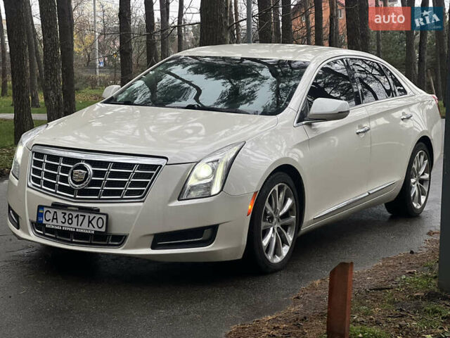 Белый Кадиллак ХТС, объемом двигателя 3.56 л и пробегом 130 тыс. км за 12000 $, фото 1 на Automoto.ua