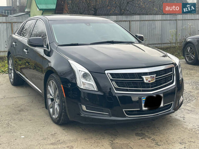 Черный Кадиллак ХТС, объемом двигателя 3.56 л и пробегом 275 тыс. км за 15600 $, фото 1 на Automoto.ua