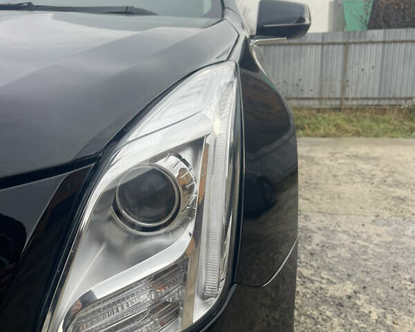 Черный Кадиллак ХТС, объемом двигателя 3.56 л и пробегом 275 тыс. км за 15600 $, фото 4 на Automoto.ua