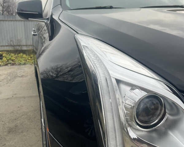 Черный Кадиллак ХТС, объемом двигателя 3.56 л и пробегом 275 тыс. км за 15600 $, фото 7 на Automoto.ua