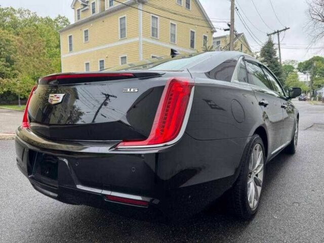 Черный Кадиллак ХТС, объемом двигателя 3.6 л и пробегом 65 тыс. км за 2300 $, фото 2 на Automoto.ua