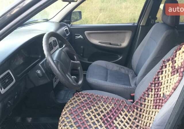 Черный Чери Амулет, объемом двигателя 1.6 л и пробегом 180 тыс. км за 2000 $, фото 4 на Automoto.ua