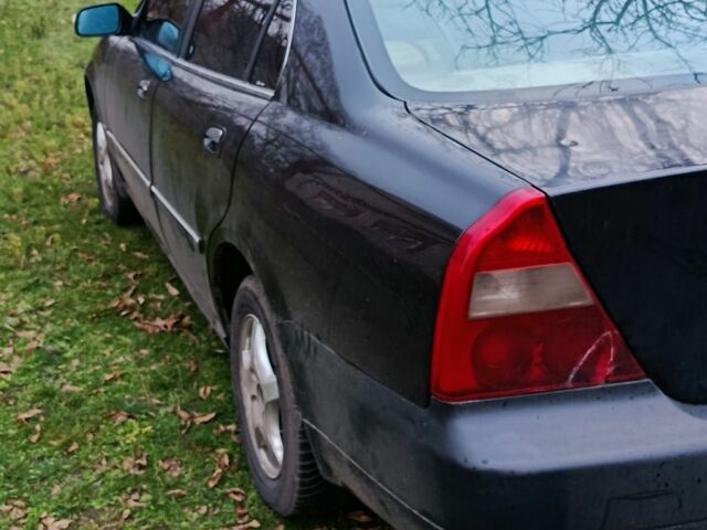 Чорний Чері Істар, об'ємом двигуна 2 л та пробігом 216 тис. км за 2400 $, фото 1 на Automoto.ua