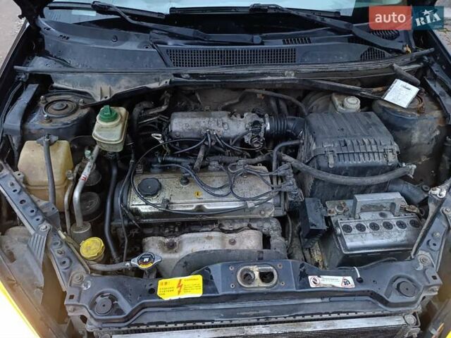 Чорний Чері Тігго, об'ємом двигуна 2 л та пробігом 231 тис. км за 2100 $, фото 4 на Automoto.ua