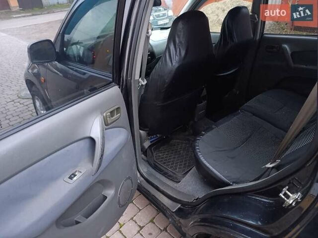 Чорний Чері Тігго, об'ємом двигуна 2 л та пробігом 231 тис. км за 2100 $, фото 28 на Automoto.ua