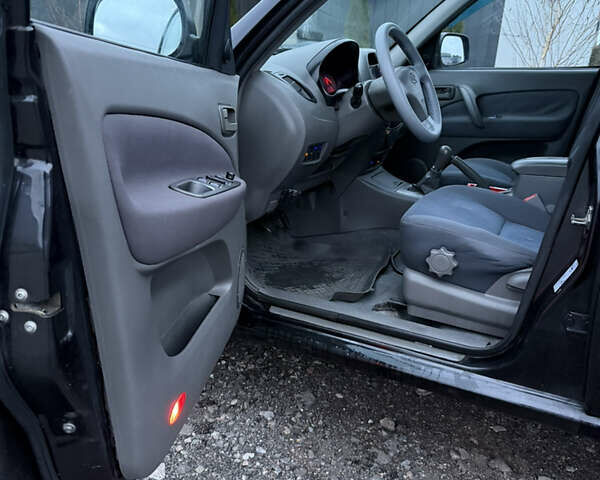 Черный Чери Тигго, объемом двигателя 2 л и пробегом 259 тыс. км за 3350 $, фото 8 на Automoto.ua