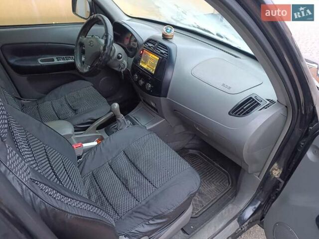 Чорний Чері Тігго, об'ємом двигуна 2 л та пробігом 231 тис. км за 2100 $, фото 26 на Automoto.ua