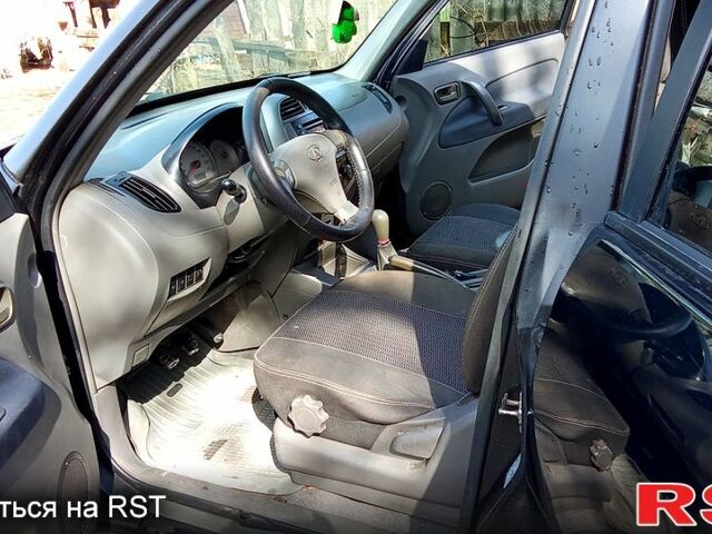 Черный Чери Тигго, объемом двигателя 2 л и пробегом 278 тыс. км за 4200 $, фото 4 на Automoto.ua