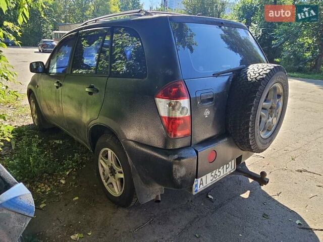 Черный Чери Тигго, объемом двигателя 2.35 л и пробегом 200 тыс. км за 1250 $, фото 1 на Automoto.ua