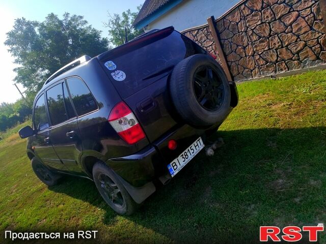 Черный Чери Тигго, объемом двигателя 2.4 л и пробегом 250 тыс. км за 3600 $, фото 2 на Automoto.ua