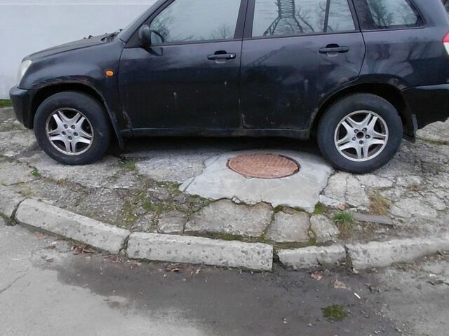 Чорний Чері Тігго, об'ємом двигуна 2 л та пробігом 287 тис. км за 2700 $, фото 1 на Automoto.ua