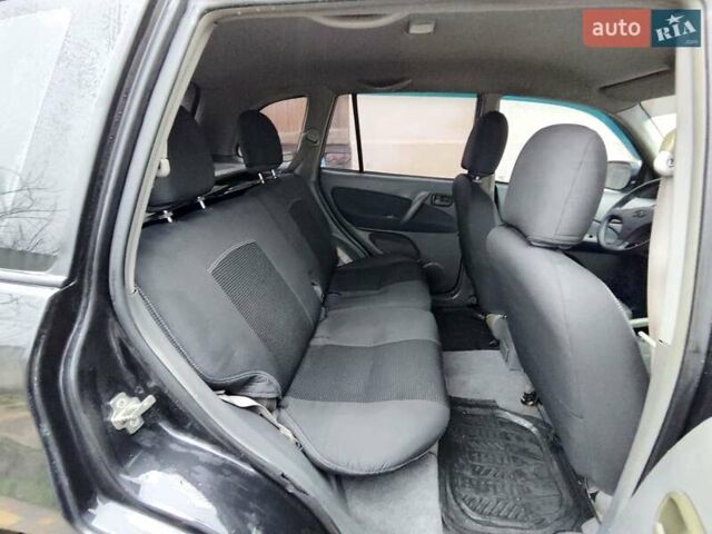 Чорний Чері Тігго, об'ємом двигуна 2 л та пробігом 170 тис. км за 4300 $, фото 4 на Automoto.ua