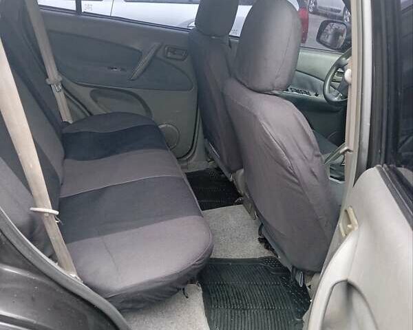 Чорний Чері Тігго, об'ємом двигуна 2 л та пробігом 130 тис. км за 3700 $, фото 6 на Automoto.ua