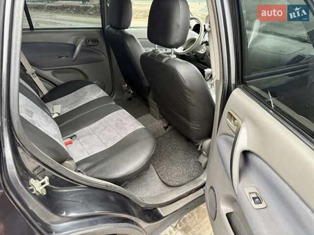 Черный Чери Тигго, объемом двигателя 2.35 л и пробегом 192 тыс. км за 3500 $, фото 13 на Automoto.ua