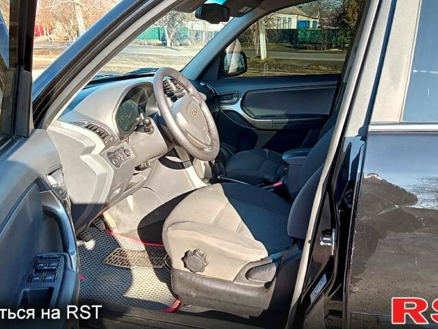 Черный Чери Тигго, объемом двигателя 1.8 л и пробегом 178 тыс. км за 5600 $, фото 7 на Automoto.ua