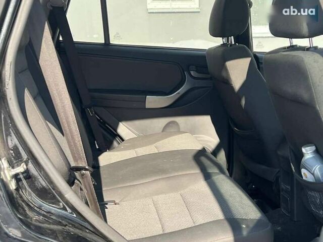 Черный Чери Тигго, объемом двигателя 1.8 л и пробегом 104 тыс. км за 5700 $, фото 16 на Automoto.ua