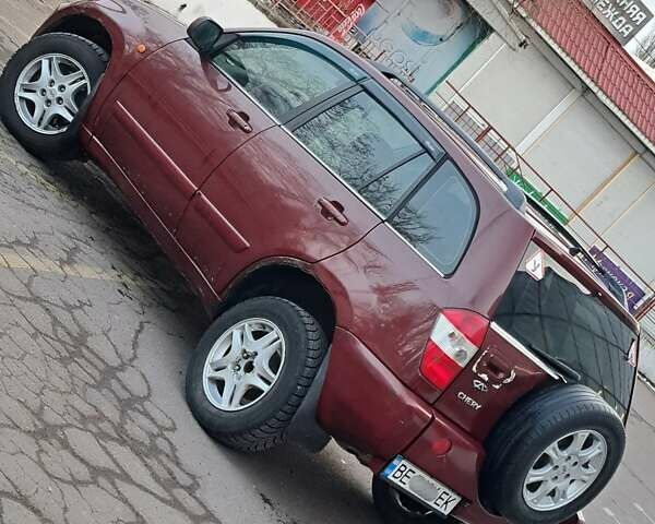 Красный Чери Тигго, объемом двигателя 2.35 л и пробегом 110 тыс. км за 4000 $, фото 5 на Automoto.ua