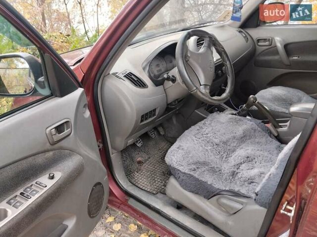 Чері Тігго 2007 у Дніпро (Дніпропетровську) на Automoto.ua Червоний Чері Тігго, об'ємом двигуна 2 л та пробігом 244 тис. км за 3700 $, фото 4 на Automoto.ua