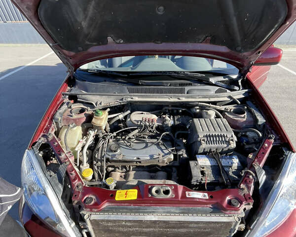 Червоний Чері Тігго, об'ємом двигуна 2.35 л та пробігом 141 тис. км за 4950 $, фото 7 на Automoto.ua