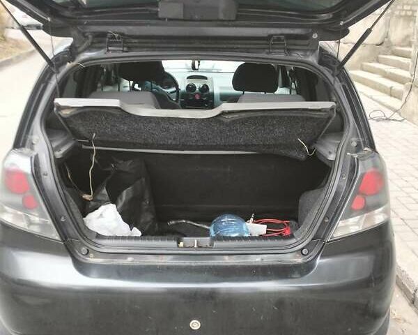 Черный Шевроле Авео, объемом двигателя 1.5 л и пробегом 143 тыс. км за 2000 $, фото 6 на Automoto.ua