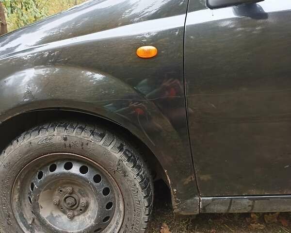 Черный Шевроле Авео, объемом двигателя 1.5 л и пробегом 216 тыс. км за 3500 $, фото 1 на Automoto.ua