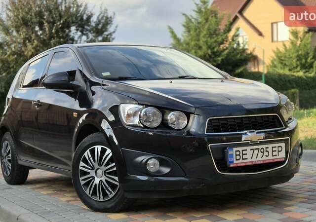 Черный Шевроле Авео, объемом двигателя 1.6 л и пробегом 168 тыс. км за 6650 $, фото 2 на Automoto.ua