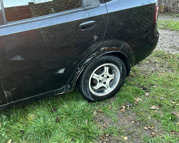 Черный Шевроле Авео, объемом двигателя 1.5 л и пробегом 335 тыс. км за 1500 $, фото 1 на Automoto.ua