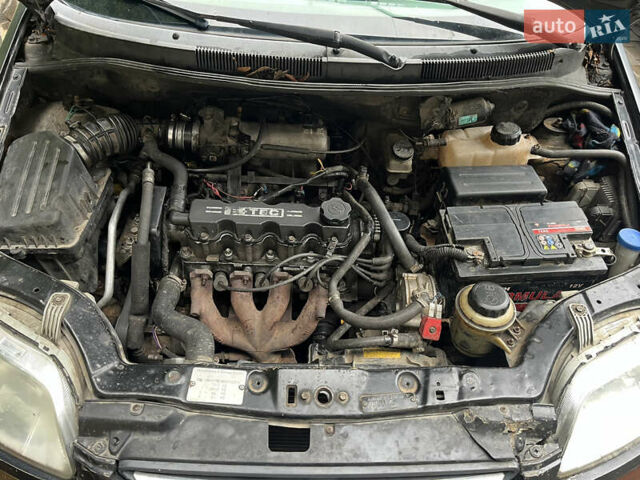 Чорний Шевроле Авео, об'ємом двигуна 1.5 л та пробігом 350 тис. км за 2600 $, фото 12 на Automoto.ua