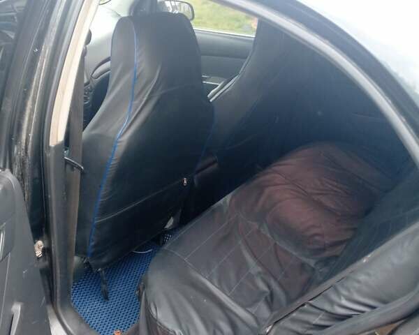 Чорний Шевроле Авео, об'ємом двигуна 1.5 л та пробігом 250 тис. км за 3350 $, фото 5 на Automoto.ua