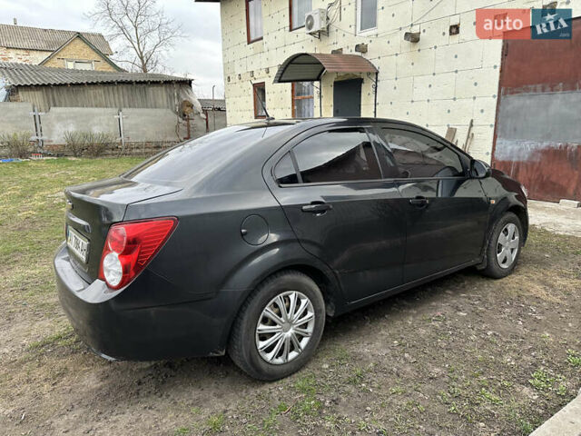 Черный Шевроле Авео, объемом двигателя 1.6 л и пробегом 143 тыс. км за 5350 $, фото 2 на Automoto.ua