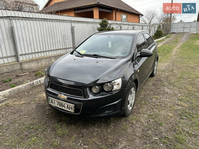Черный Шевроле Авео, объемом двигателя 1.6 л и пробегом 143 тыс. км за 5350 $, фото 1 на Automoto.ua