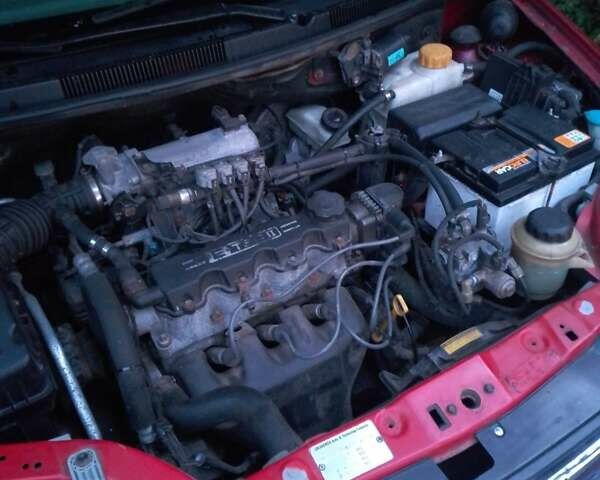 Красный Шевроле Авео, объемом двигателя 1.5 л и пробегом 130 тыс. км за 2400 $, фото 3 на Automoto.ua