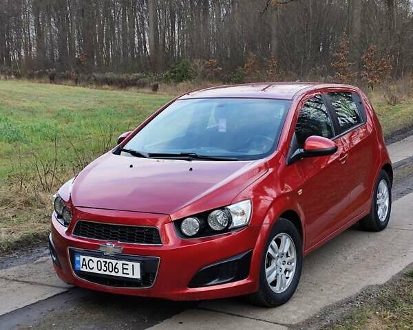 Червоний Шевроле Авео, об'ємом двигуна 1.3 л та пробігом 250 тис. км за 5999 $, фото 4 на Automoto.ua