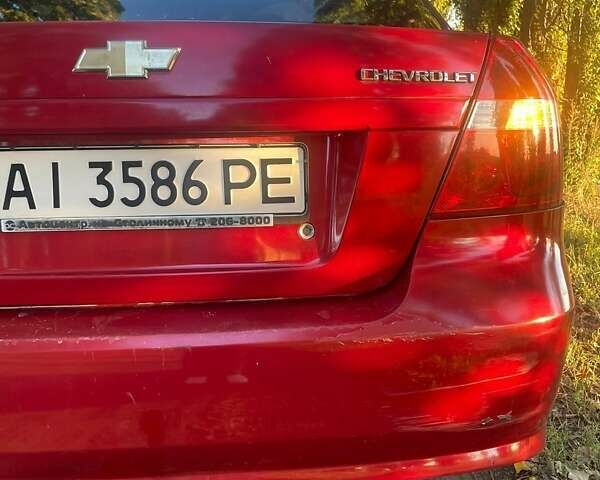 Красный Шевроле Авео, объемом двигателя 1.5 л и пробегом 210 тыс. км за 3400 $, фото 12 на Automoto.ua