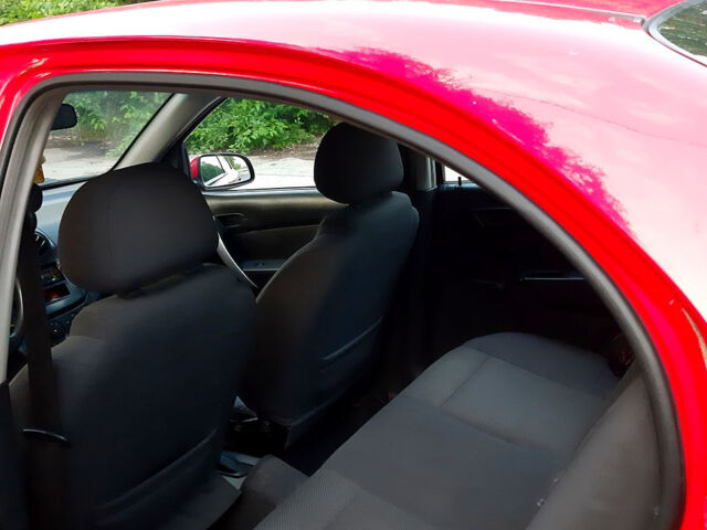 Червоний Шевроле Авео, об'ємом двигуна 1.5 л та пробігом 177 тис. км за 1950 $, фото 6 на Automoto.ua