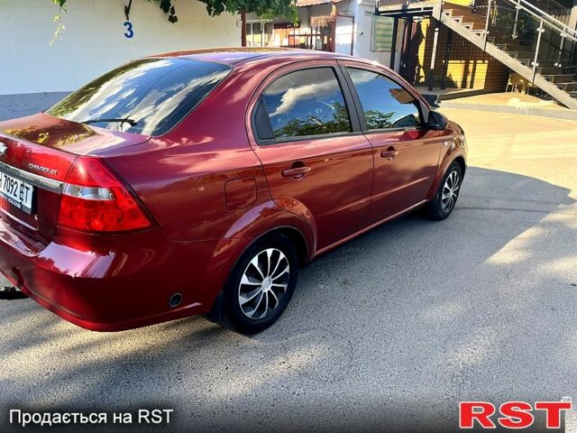 Красный Шевроле Авео, объемом двигателя 1.6 л и пробегом 250 тыс. км за 3500 $, фото 2 на Automoto.ua