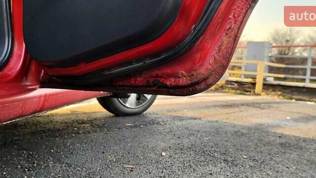 Красный Шевроле Авео, объемом двигателя 1.4 л и пробегом 202 тыс. км за 3600 $, фото 34 на Automoto.ua