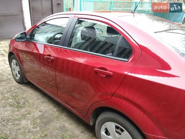 Красный Шевроле Авео, объемом двигателя 1.4 л и пробегом 83 тыс. км за 6600 $, фото 4 на Automoto.ua