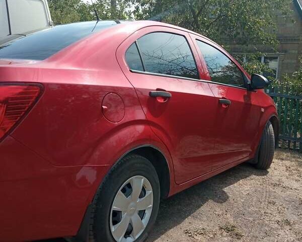 Красный Шевроле Авео, объемом двигателя 1.4 л и пробегом 61 тыс. км за 7300 $, фото 4 на Automoto.ua