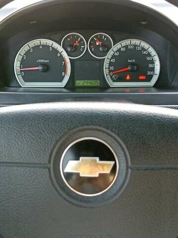 Серый Шевроле Авео, объемом двигателя 1.5 л и пробегом 244 тыс. км за 3950 $, фото 4 на Automoto.ua